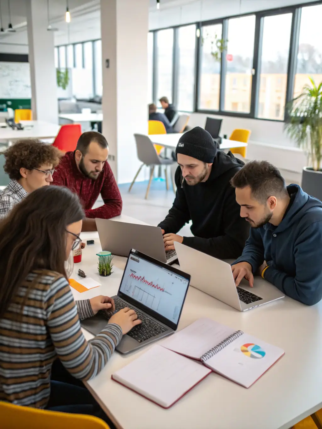 A professional photograph of a team of Drupal developers collaborating on a complex coding project, showcasing their expertise and teamwork in a modern office setting.